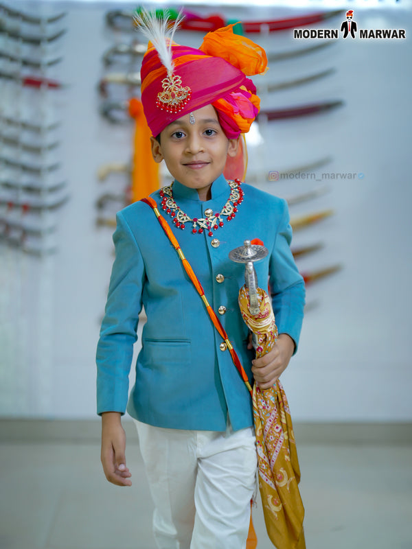 Kids Jodhpuri velvet coat suit in blue with traditional accessories and colorful turban for festive occasions