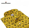 Yellow printed shirt for men by Singh with intricate black floral pattern and button-up collar