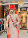 Elegant traditional Indian sherwani for men with intricate embroidery and matching turban, perfect for weddings