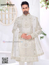 Elegant wedding groom sherwani combo in white with intricate embroidery and matching dupatta