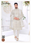 Elegant wedding groom sherwani combo in white with intricate embroidery and matching accessories