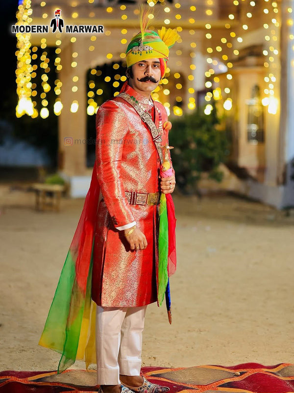 Traditional wedding groom sherwani in vibrant colors with ornate details and colorful turban