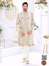 Elegant wedding groom sherwani combo in cream with intricate embroidery and matching accessories