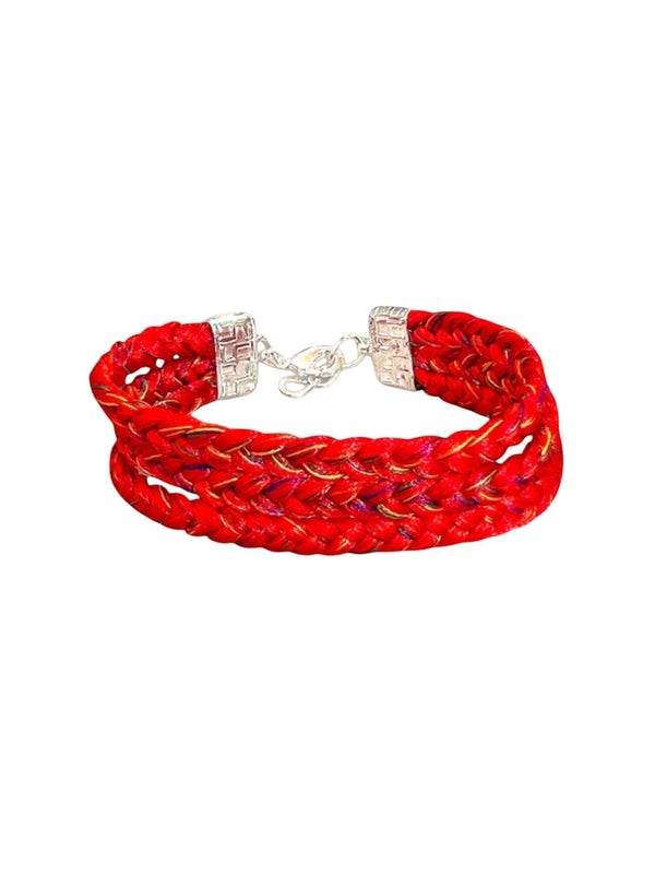 Modern Marwar red braided hand bracelet with silver clasp, perfect for weddings and celebrations.