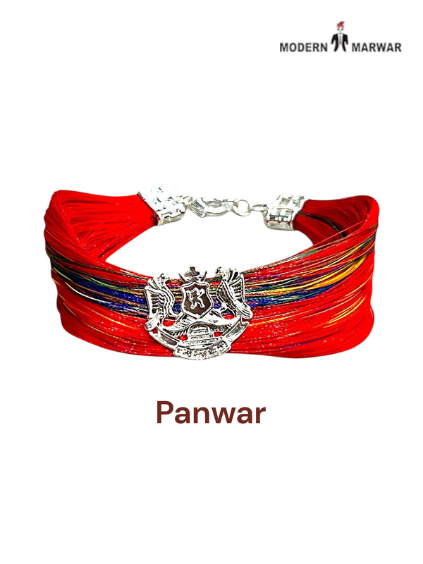 Default red bracelet with fabric strands featuring the Panwar logo moli bracelet at a side angle