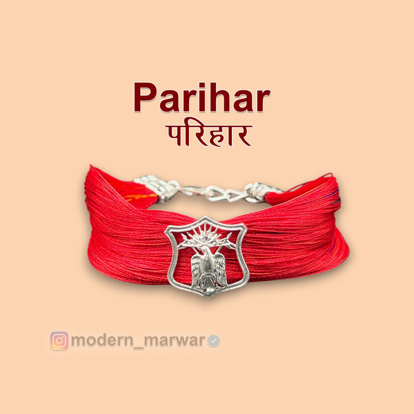 Parihar logo rakhi bracelet in red with a silver emblem for Raksha Bandhan celebrations