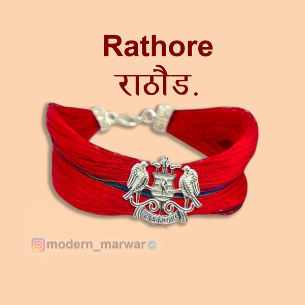 Rathore logo moli bracelet in red threads featuring intricate design and silver detailing