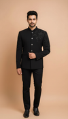 Elegant black royal bandhgala suit for men with intricate floral detailing and a tailored fit
