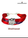 Default red fabric Shekhawat moli bracelet with a silver emblem from SINGH