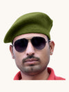 Default green wool beret cap online worn by a man with sunglasses for a stylish look