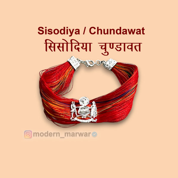 Sisodiya Chundawat moli bracelet with vibrant red threads and decorative silver accents