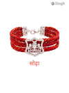M Hand Use Red Fabric Bracelet with Silver Shield Charm from Singh at an angle