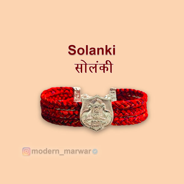 Solanki logo moli bracelet in red with intricate design and silver charm for style and tradition