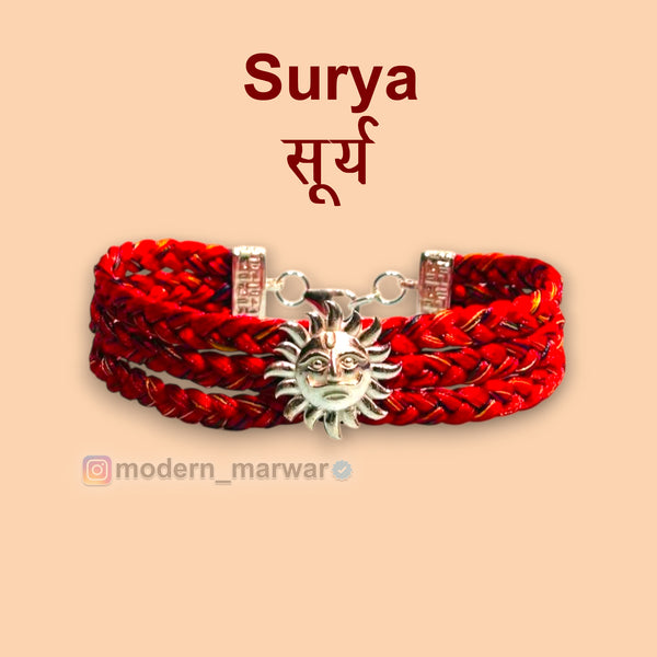 Surya logo moli bracelet with a braided red design and sun emblem for a stylish look
