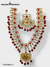Elegant traditional Indian necklace set with intricate designs and red embellishments for special occasions