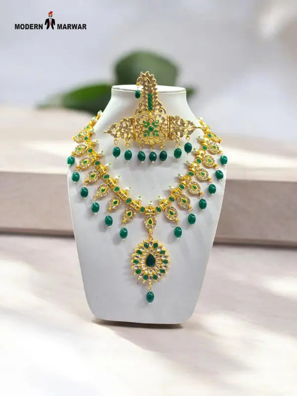 Elegant traditional necklace set in gold with green beads for festive occasions