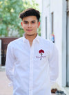 White men's Rajput design shirt with red embroidered logo worn by a young man
