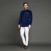 Elegant M Jodhpuri suit featuring a blue velvet coat suit for weddings paired with tailored white trousers