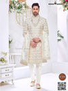 Elegant wedding groom sherwani combo in cream with intricate embroidery and matching accessories