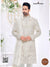 Elegant wedding groom sherwani combo in cream with intricate embroidery and matching dupatta