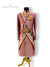 Elegant wedding sherwani for men in pink with intricate embroidery and ornate accessories